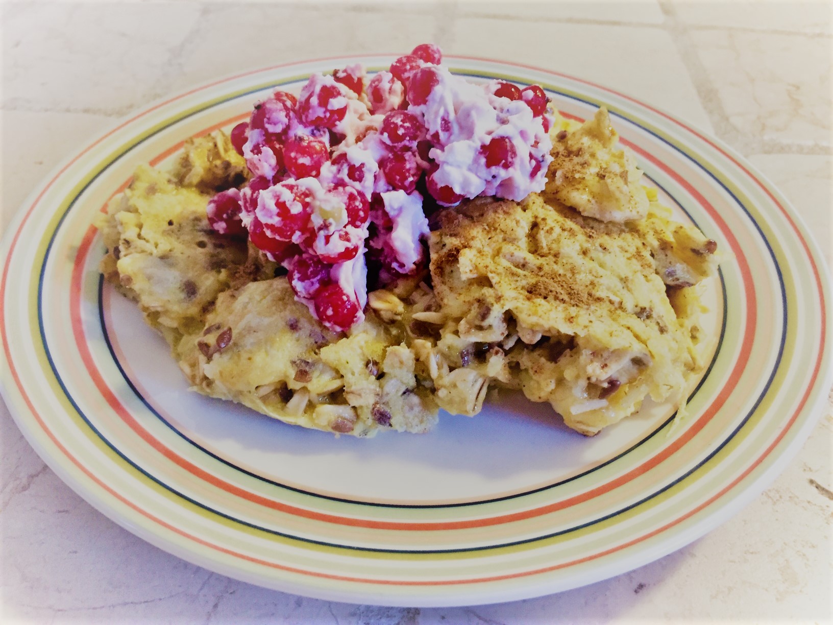 Scrambled pancakes with coconut berry topping